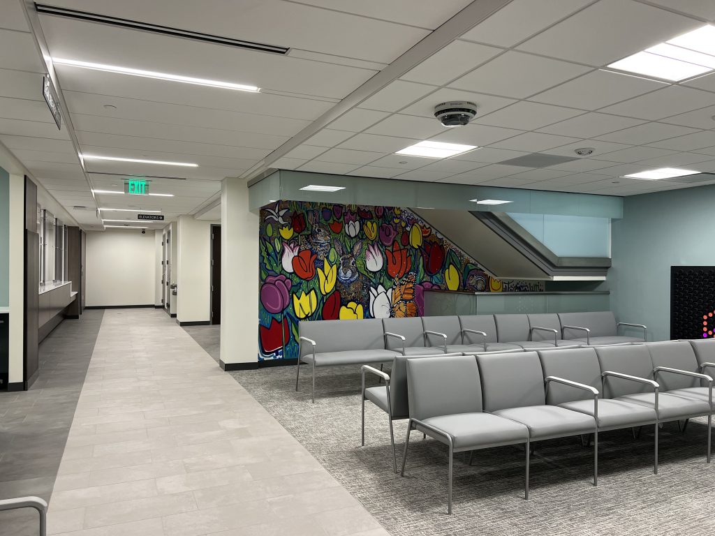 Garden level Lobby with mural of tulips and a rabbit in the background